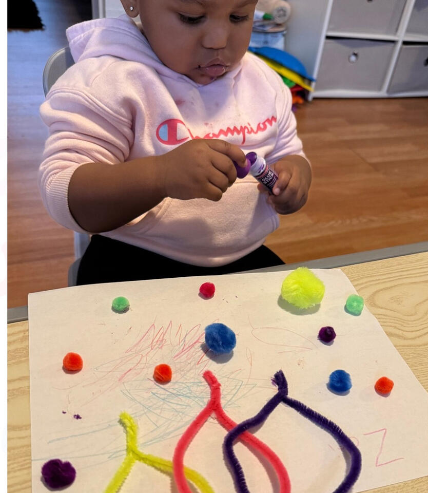 Child participating in a hands-on creative learning activity at Advanced Childcare Services LLC